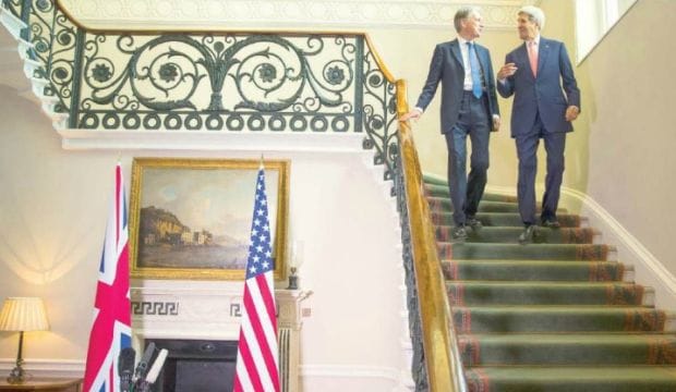 US says Assad must go, timing down to negotiation