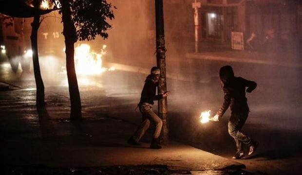 Scuffles break out as police hold back Turkish mourners