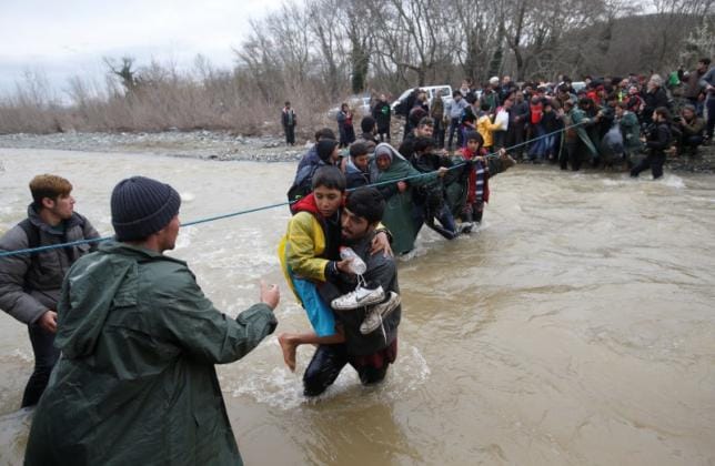 Hundreds of Migrants March out of Greek Camp to Macedonia