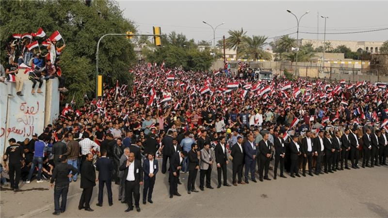 Iraqis Protest by Burning Khomeini and Supreme Leader Photos