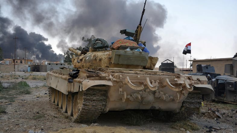 U.S. Soldiers Wear Gas Masks in Qayyara