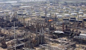 Oil prices fall below $100 per barrel for first time in 14 months