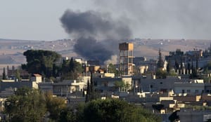 ISIS presses assault on Syrian border town, Kurds warn Turkey