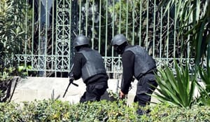Attack on Tunisian museum leaves 21 dead; manhunt for gunmen