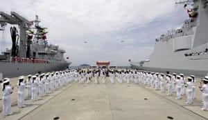 China to extend military reach, build lighthouses in disputed waters