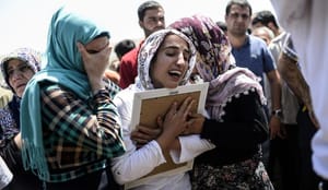 Kurds mourn, protest after bombing at Turkish election rally