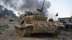 U.S. Soldiers Wear Gas Masks in Qayyara